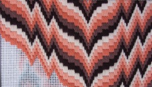 Voorbeeld van Bargello borduurwerk in geschakeerde kleuren.