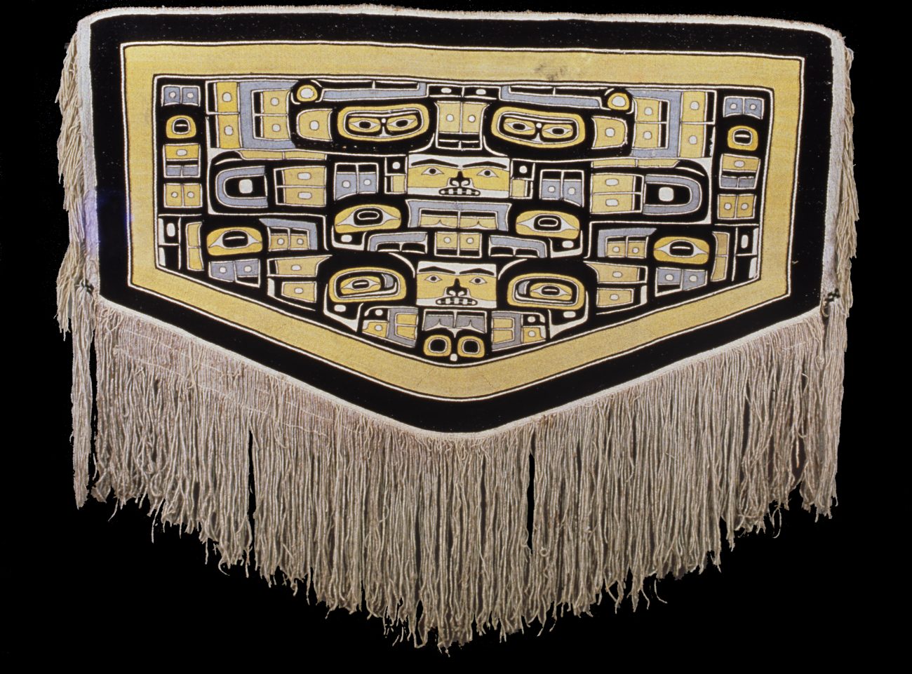 Chilkat deken, berggeit-wol en cederbast, 19de eeuw (Burke Museum, VS).