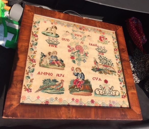 Een merklap uit 1876, de maakster was 13 jaar oud.